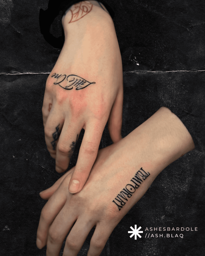 Custom minimalist black script tattoo with fine line created by tattoo artist Ashes Bardole in Salt Lake City.