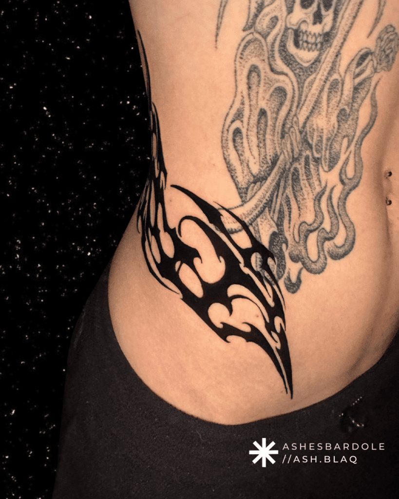 Fantasy blackwork tattoo with bold linework and high contrast, created by Ashes Bardole, a blackwork tattoo artist specializing in custom designs.